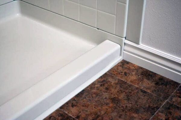 Semi-permanent removable acrylic shower dam
