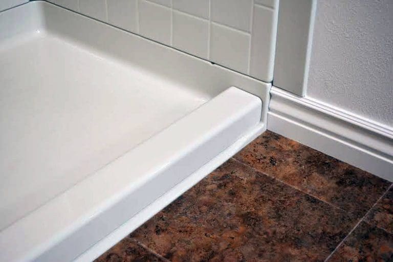 Semi-permanent removable acrylic shower dam